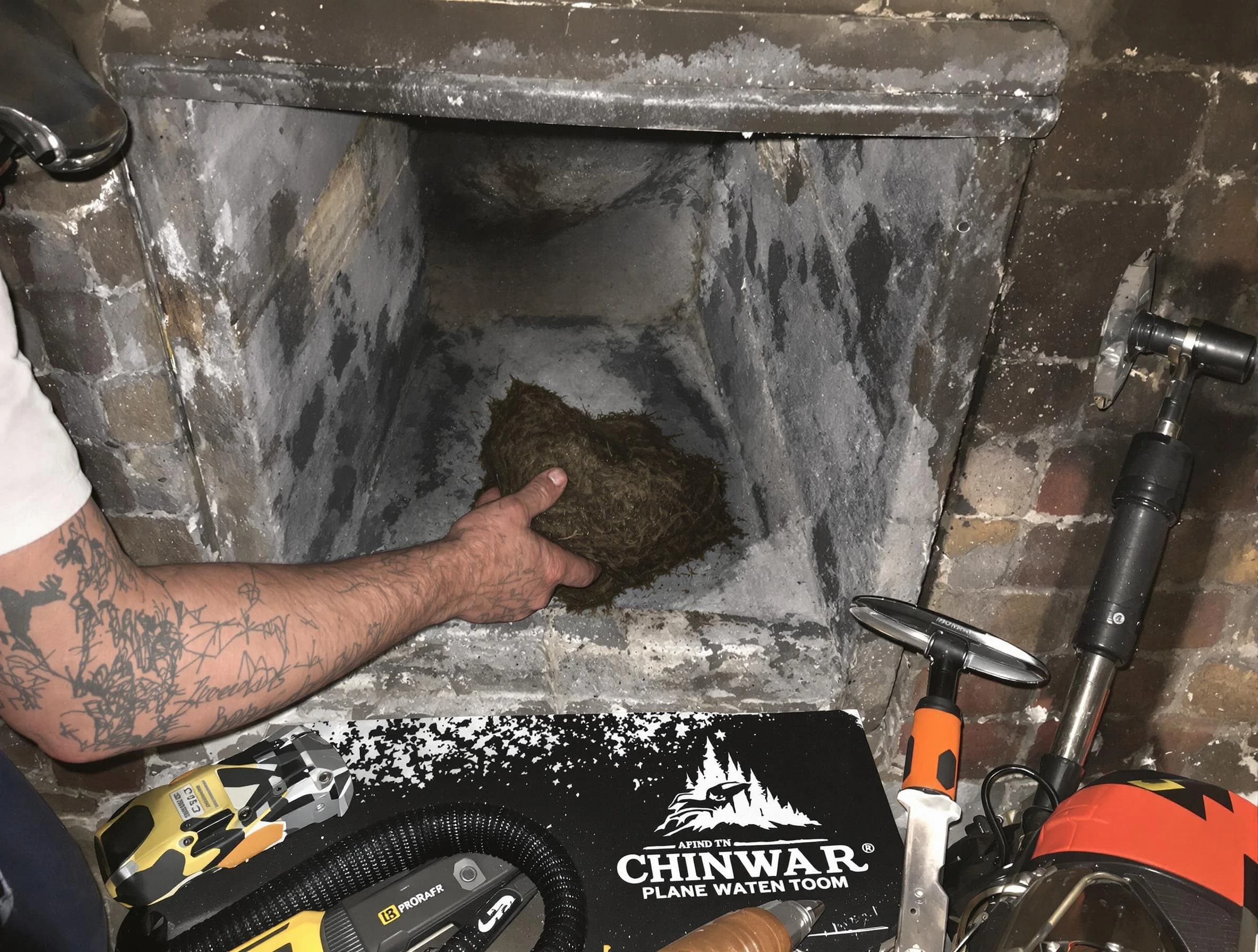 Denver Chimney Sweep safely removing debris and screening chimney in Denver, CO